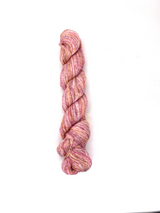 Braided pink yarn on a white background