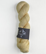 Yarn skein with a label on a white background