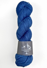 Blue skein of yarn with a label on a white background