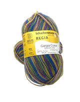 Multicolored ball of yarn with a Schachenmayr Regia label on a white background